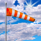 Broken at 7000ft, Broken at 8500ft wind sock with sun and broken clouds